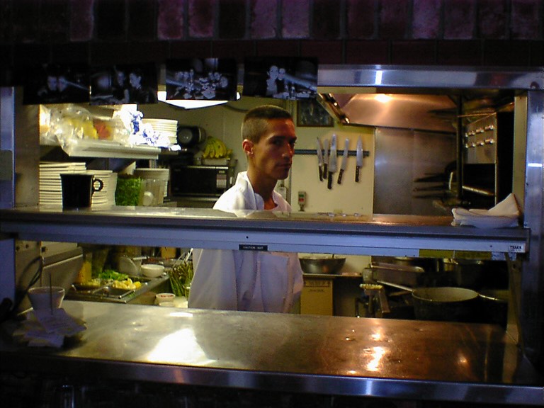 Chef working the original four-foot service window